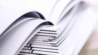 stack of magazines open