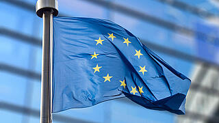European Union flag against European Parliament