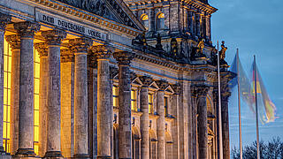 The entrance portal of the Reichstag in Berlin at twilight
