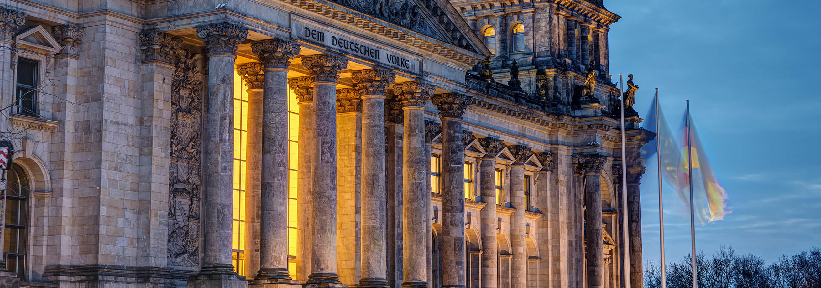 The entrance portal of the Reichstag in Berlin at twilight